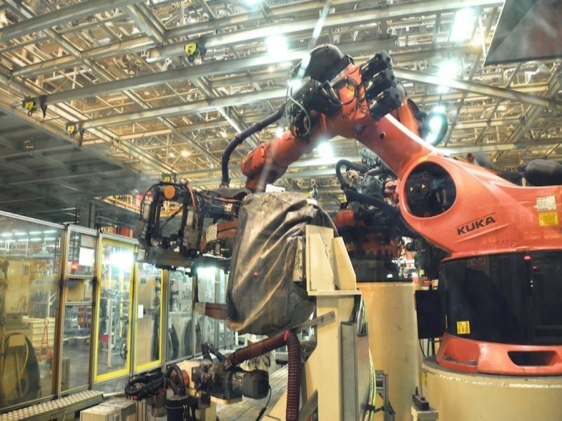 automotive body welding automation system with robotic integration and control units